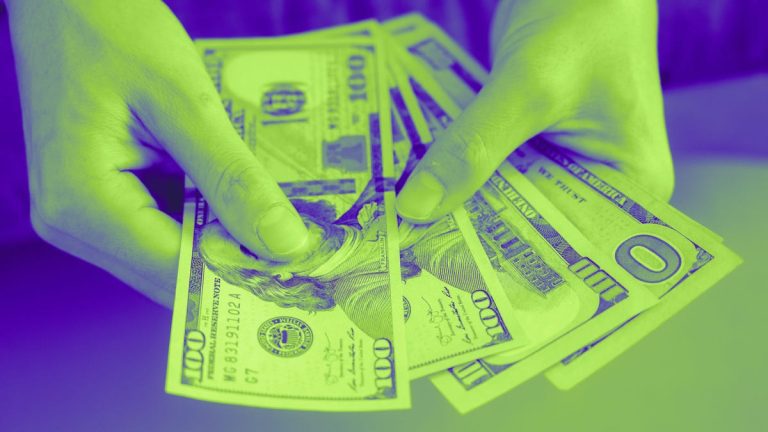 Hands holding US money