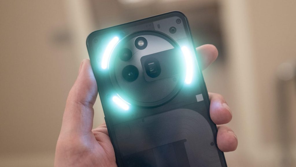 A Nothing Phone 3A Pro with its back lighting shining bright at MWC 2025